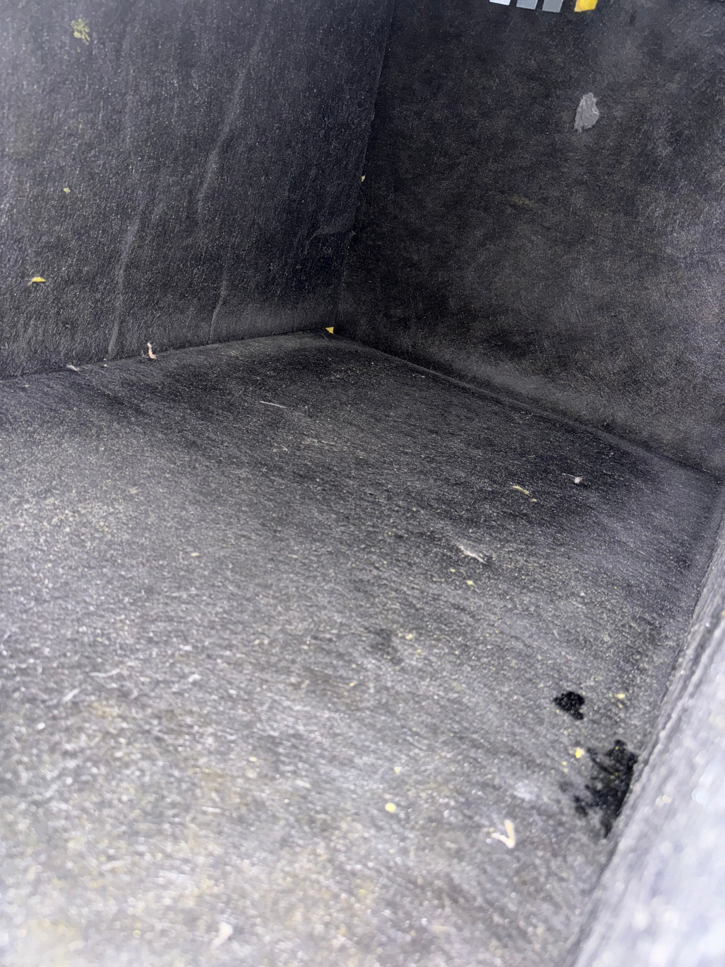 Inside of dirty air duct plenum showing dust buildup